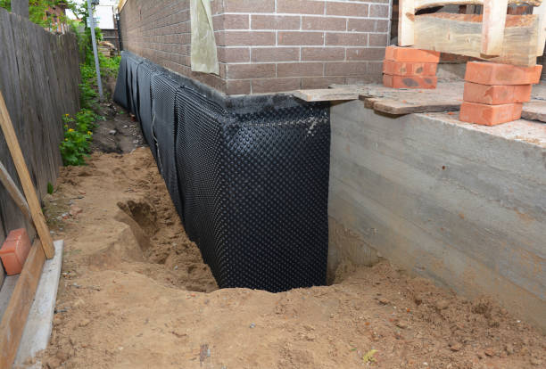 SJ Waterproofing Pros technician performing targeted Exterior Waterproofing assessment in Churchville, NY